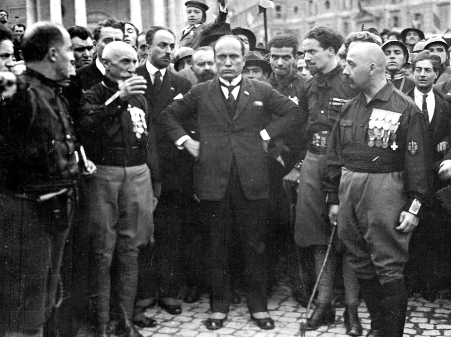 Benito Mussolini (center)