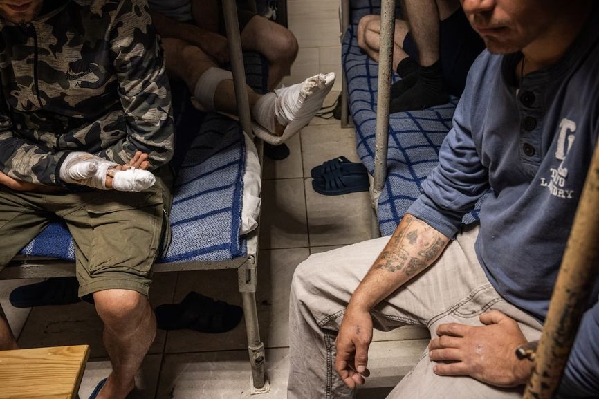 Captured Russian soldiers and border guards held in a cell at a Ukrainian prison in northeastern Ukraine