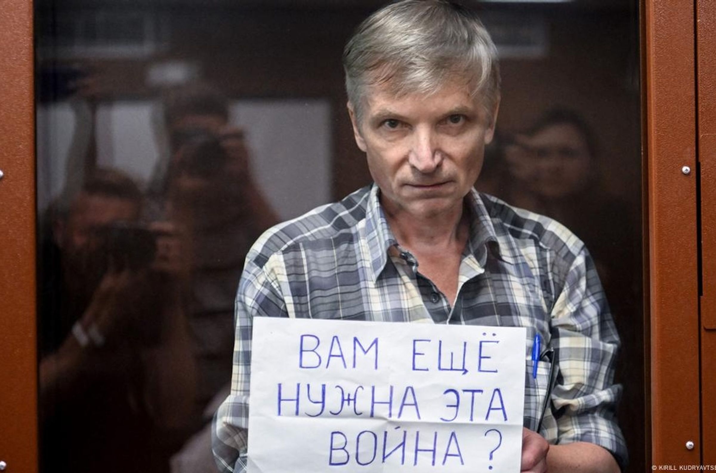 Alexei Gorinov holding a sign “Do you still need this war?”