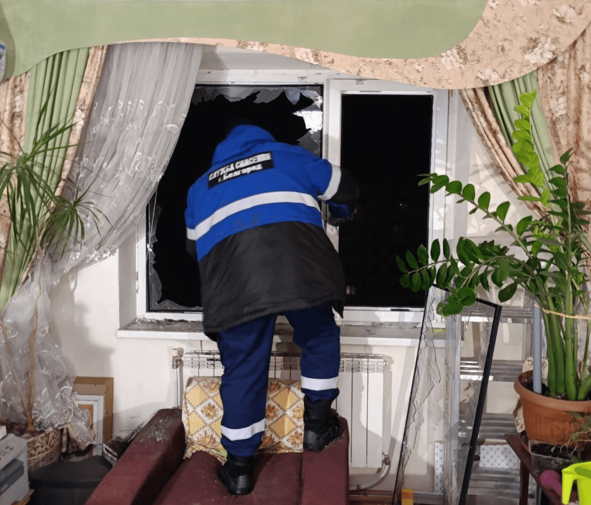 An emergency worker at an apartment in Belgorod damaged by Ukrainian shelling on February 13, 2026. Source: “Nastoyashchy Gladkov” (@vvgladkov) / Telegram