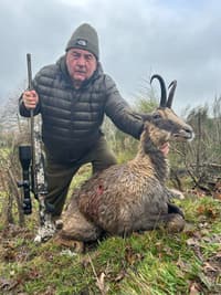 Vasily Shestakov posing with a dead animal in Spain