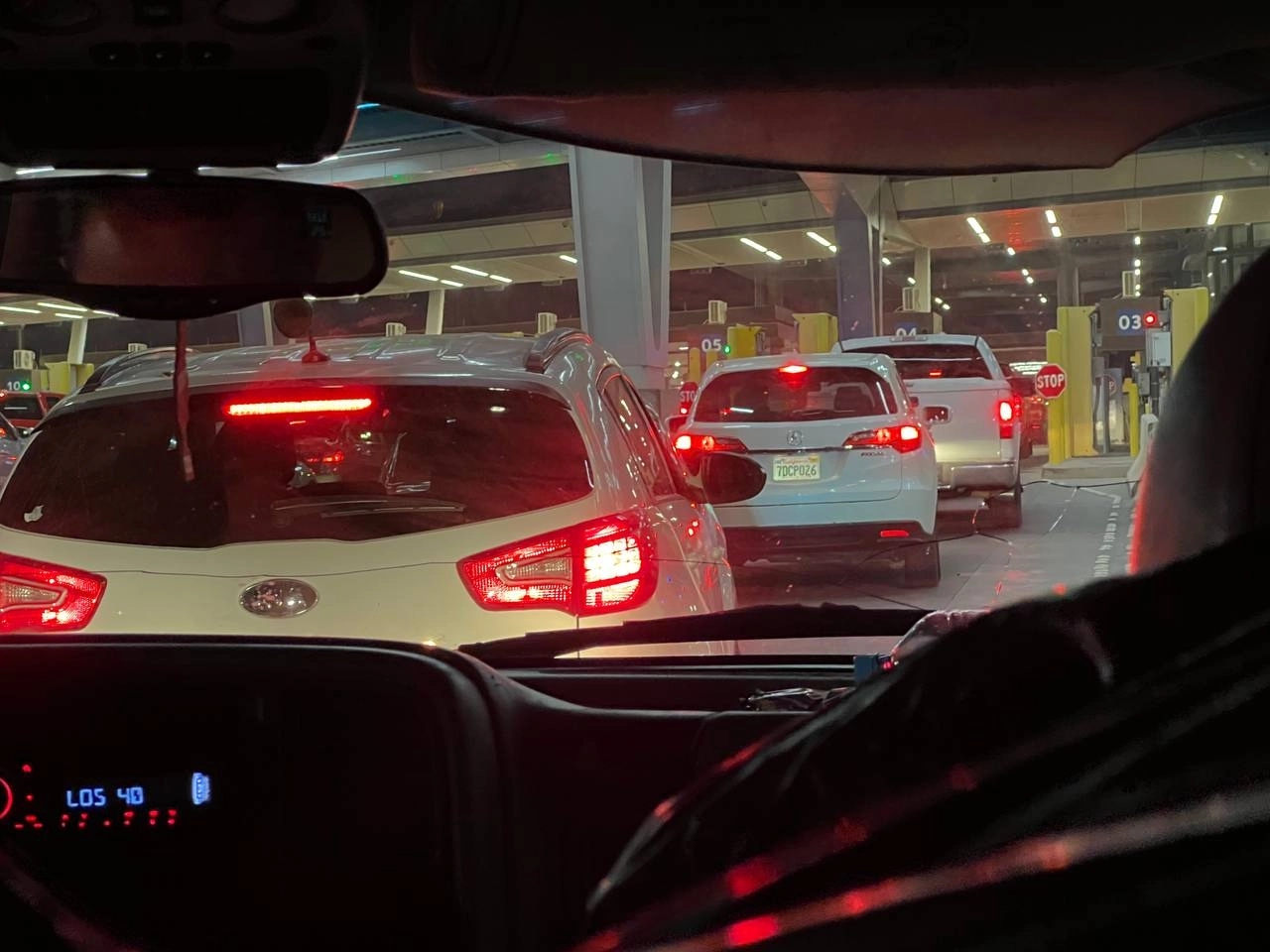 A line of vehicles at the U.S.–Mexico border