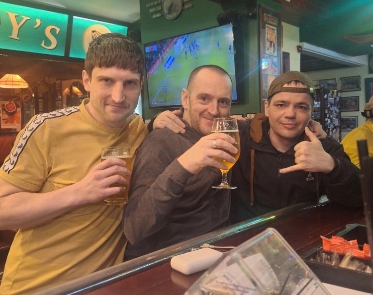Bradley Townsend, Benjamin Stimson and Aiden Minnis at a pub in Russia