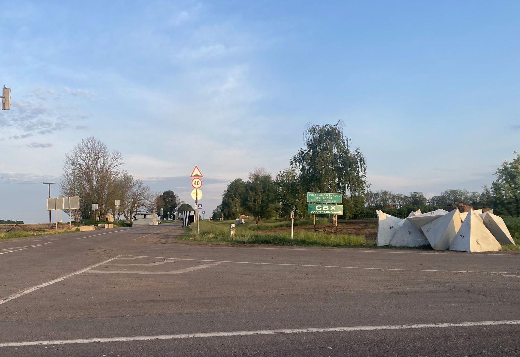 Crossroads and the road to Volchansk, Wagner cones on the right, empty fortifications in the distance