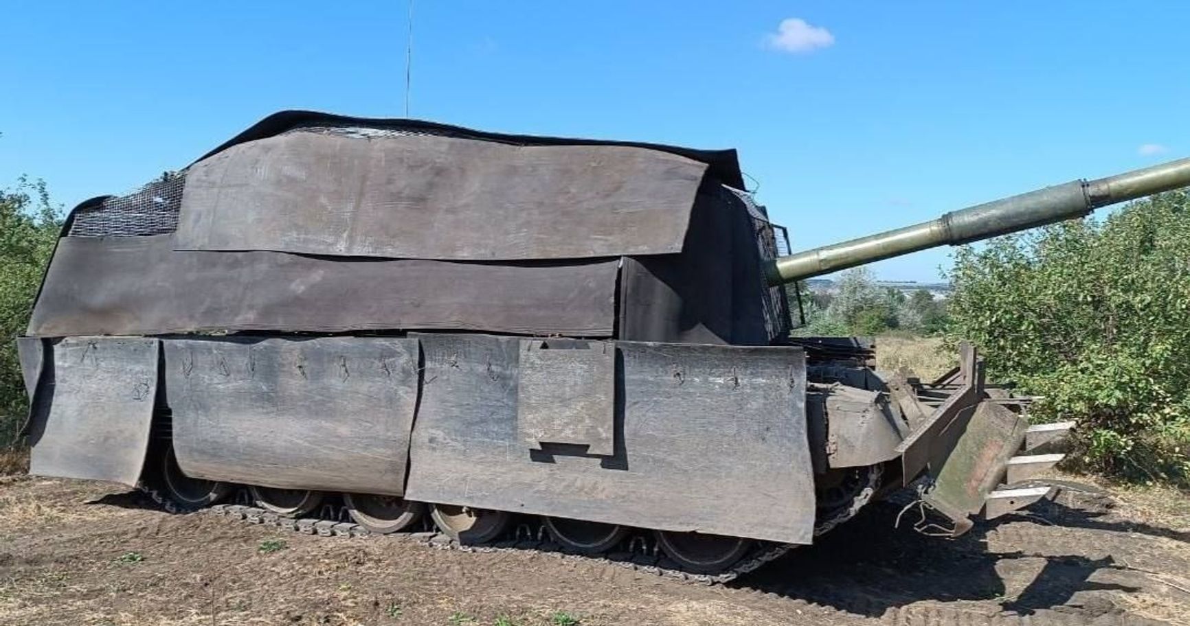 A Russian tank enclosed with a rubber “tsar-mangal.”