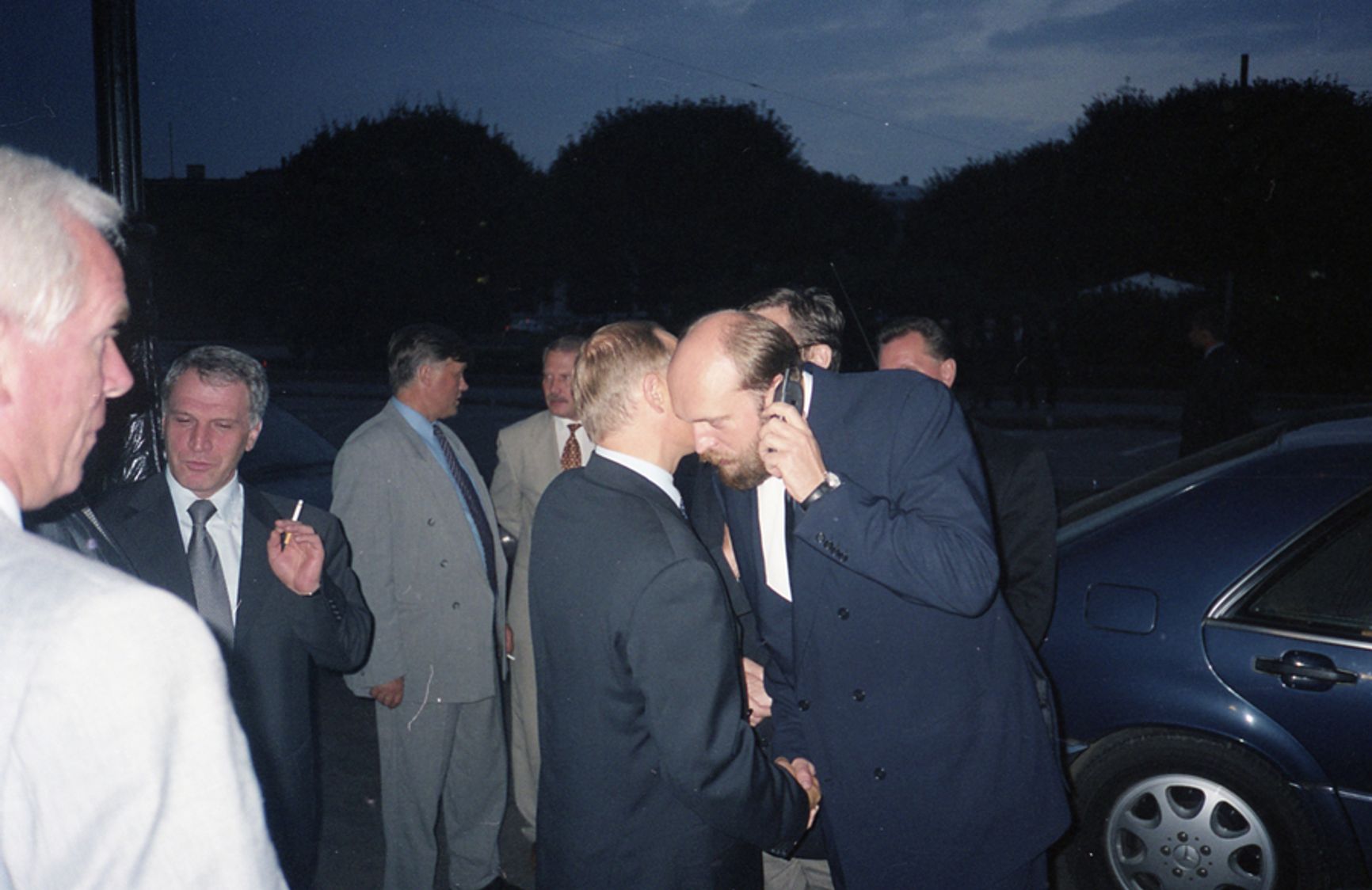 Yakunin (center), the Kovalchukis (left) and Putin on Isaakievskaya Square in the early 2000s